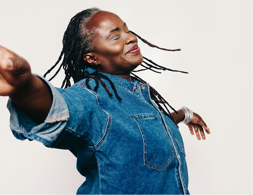 Woman dancing and looking happy